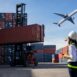 Foreman control loading Containers box to truck for Logistic Import Export Background, Business logistic concept, import and export concept.