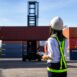 Foreman control loading Containers box to truck for Logistic Import Export Background, Business logistic concept, import and export concept.
